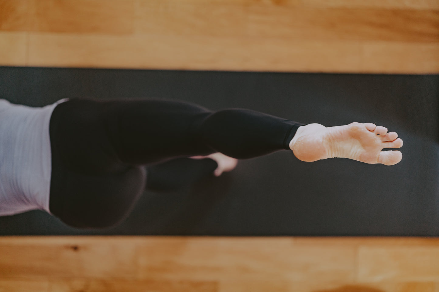 A photo of cooking and preparation with four bowls and a hand sprinkling pomegranates onto one of the bowls