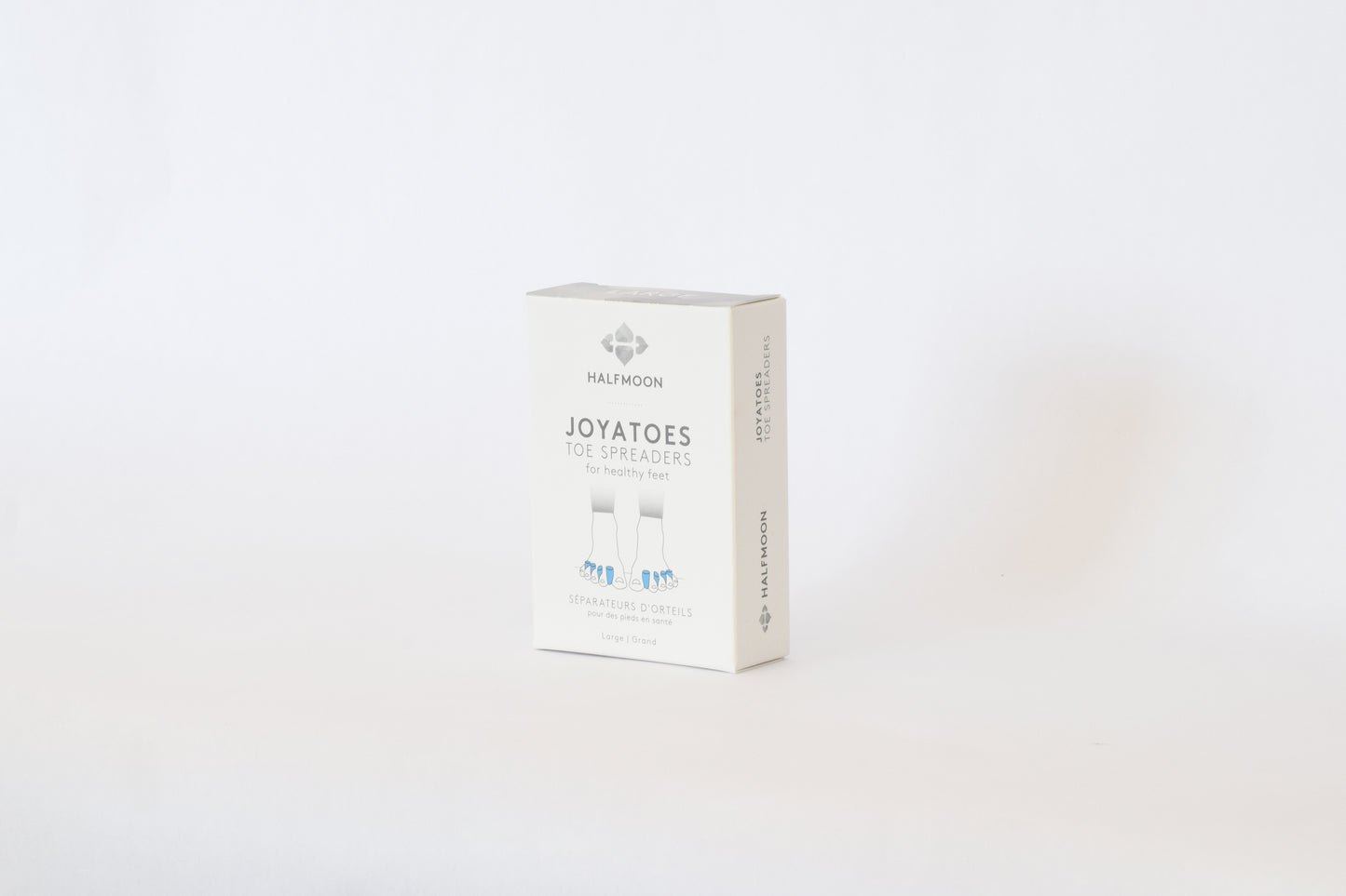 White Joy-a-toe box photographed on a white background.