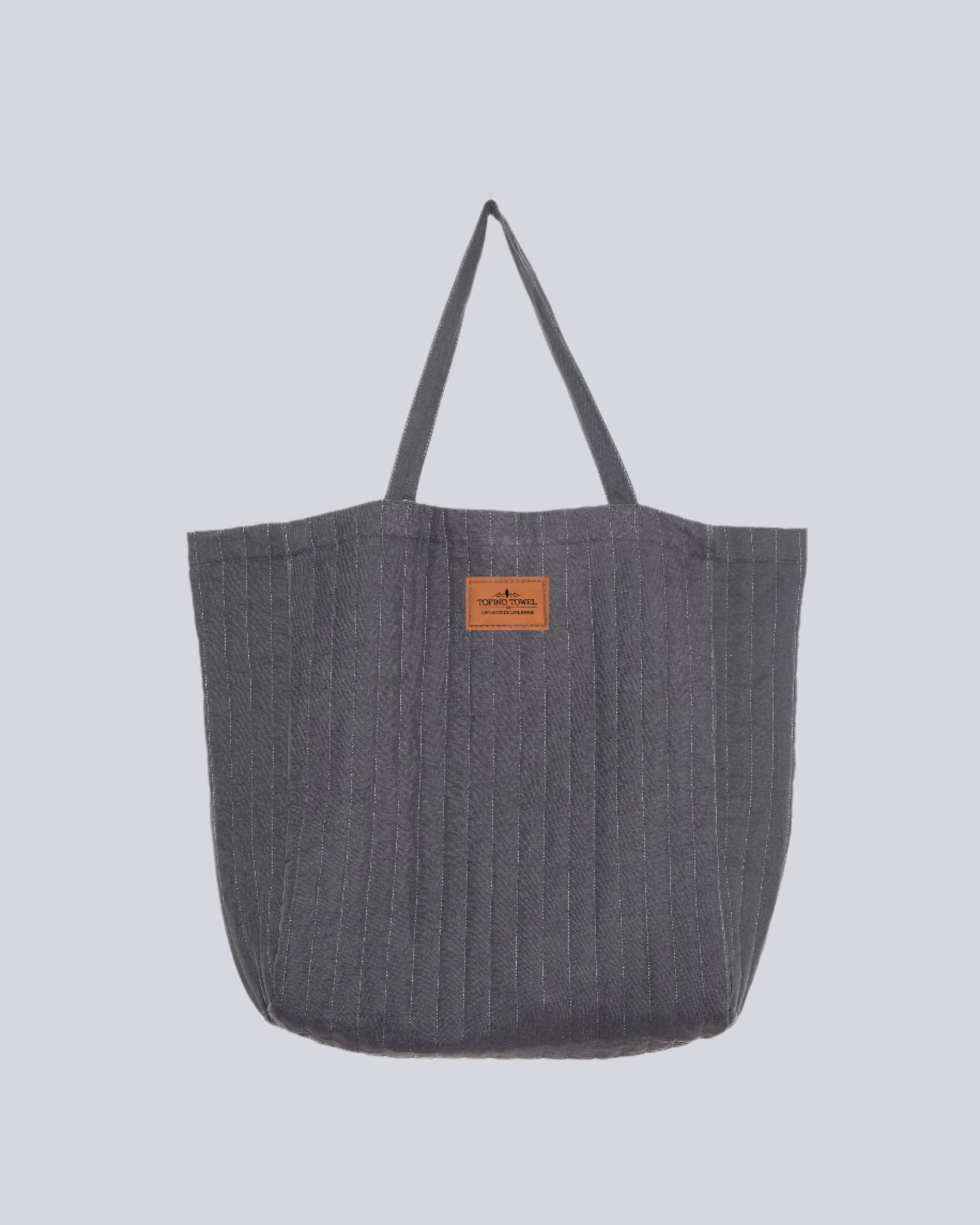 Charcoal ESME oversized quilted tote - photographed on a white background with tan label of Tofino Towel