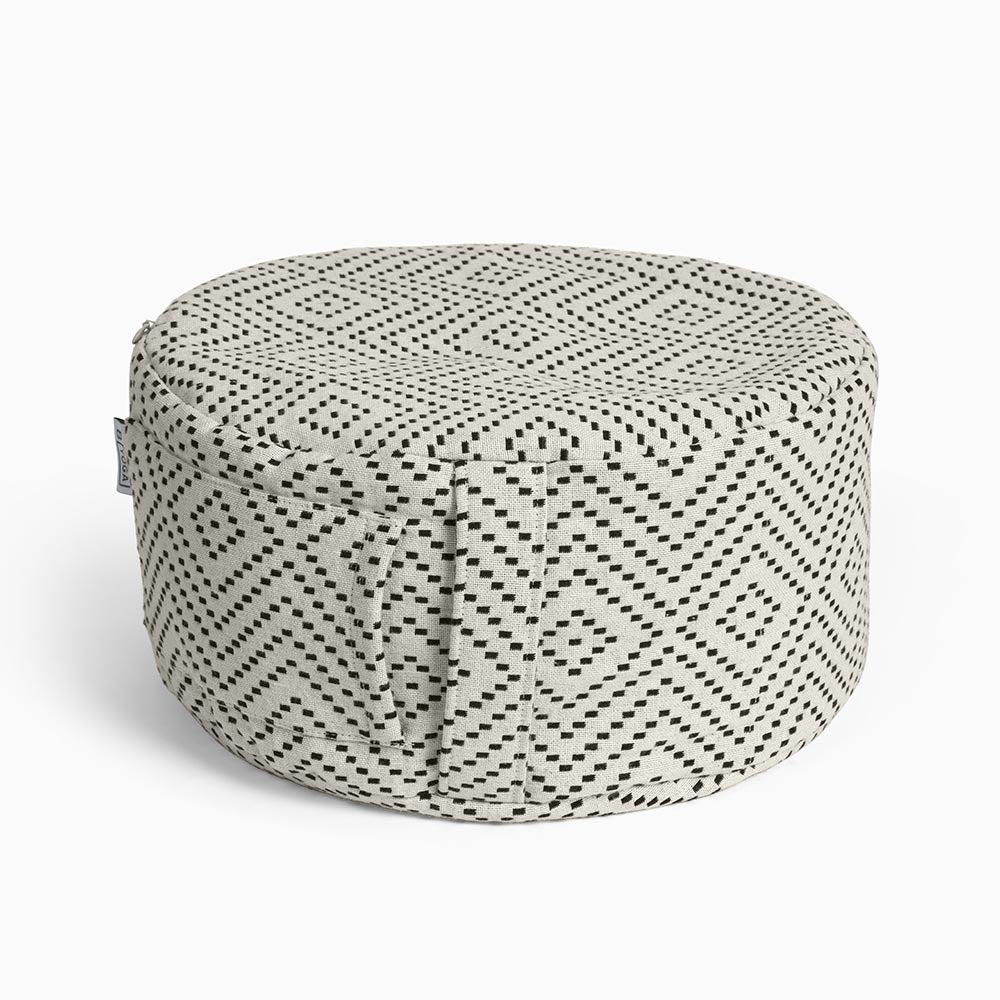 The Calm - Meditation Cushion in beige and black colour - Modern City Day - round modern cushion with removable washable cover photographed close up on a white background