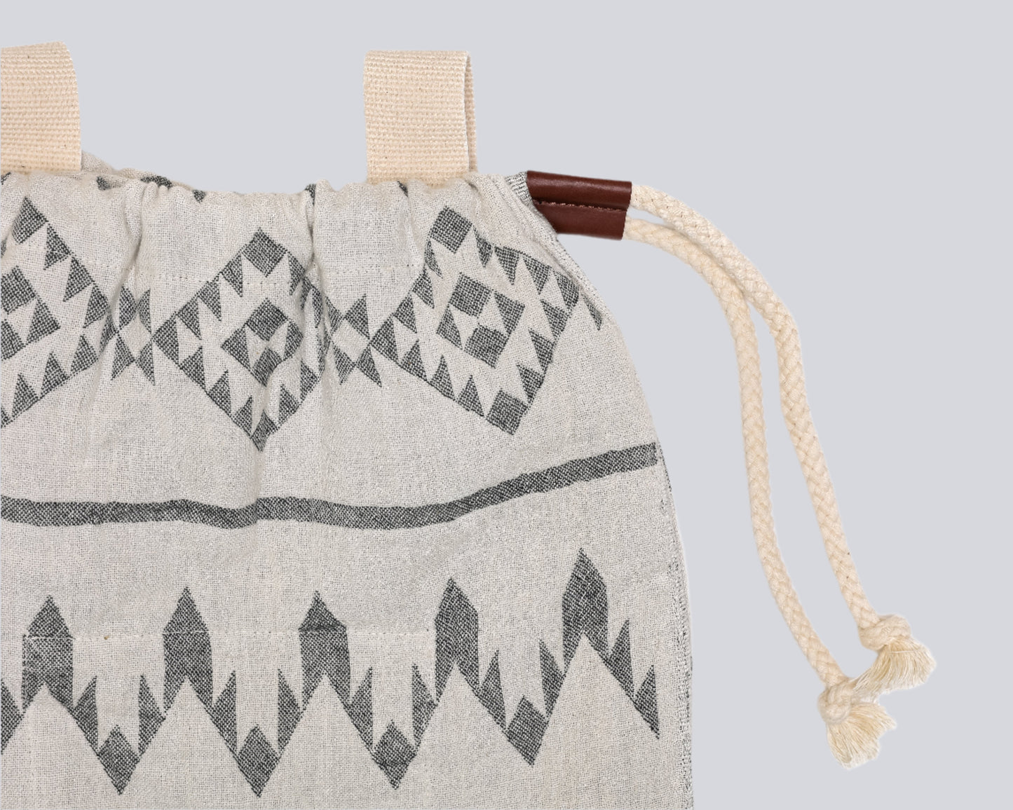 Close up of The Day Tripper Towel Backpack in Granite colour - on a white backdrop