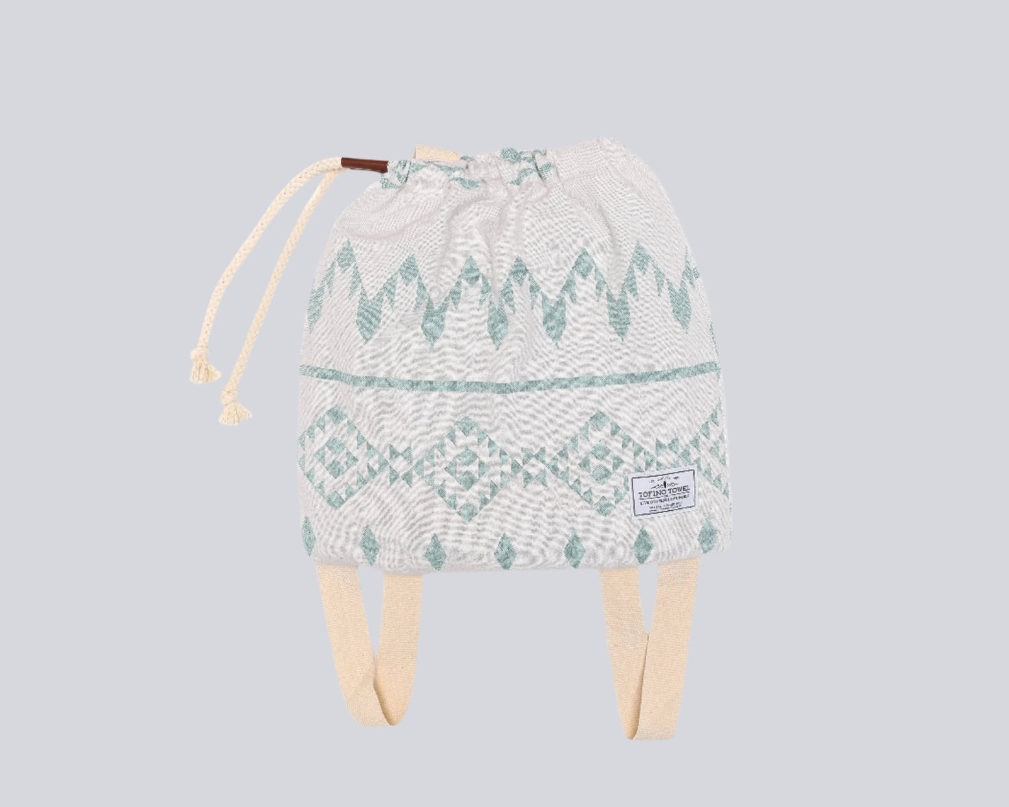 The Day Tripper Towel Backpack in Sage colour - on a white backdrop