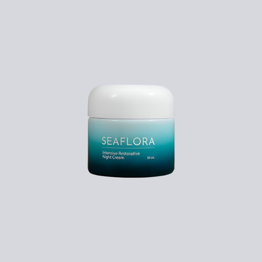 Product shot of Seaflora - Intensive Restorative Night Cream shown on a white background - in white fade bottle to aqua and dark aqua - horizontal white branding of Seaflora label