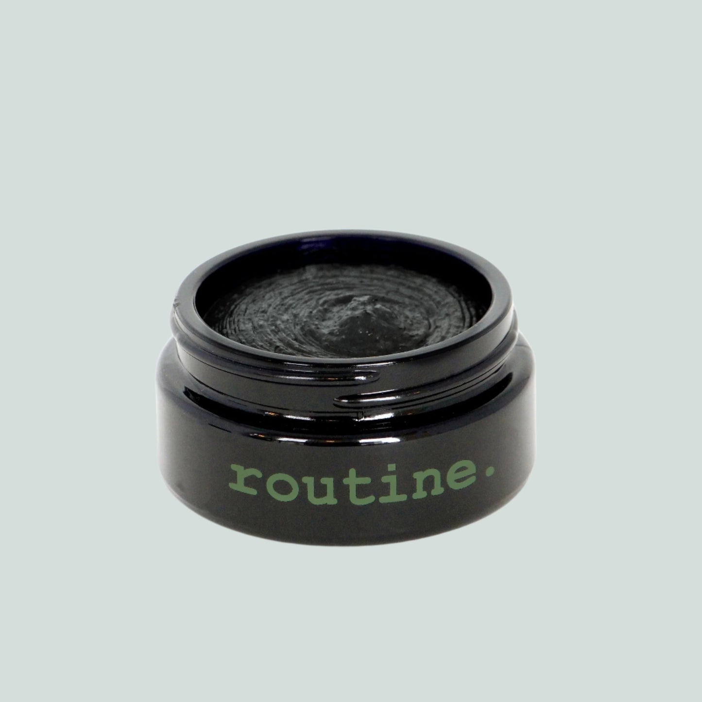 Forest Green Sticker onOpen  jar showing product of Routine Natural Deodorant Cream - Dirty Hipster