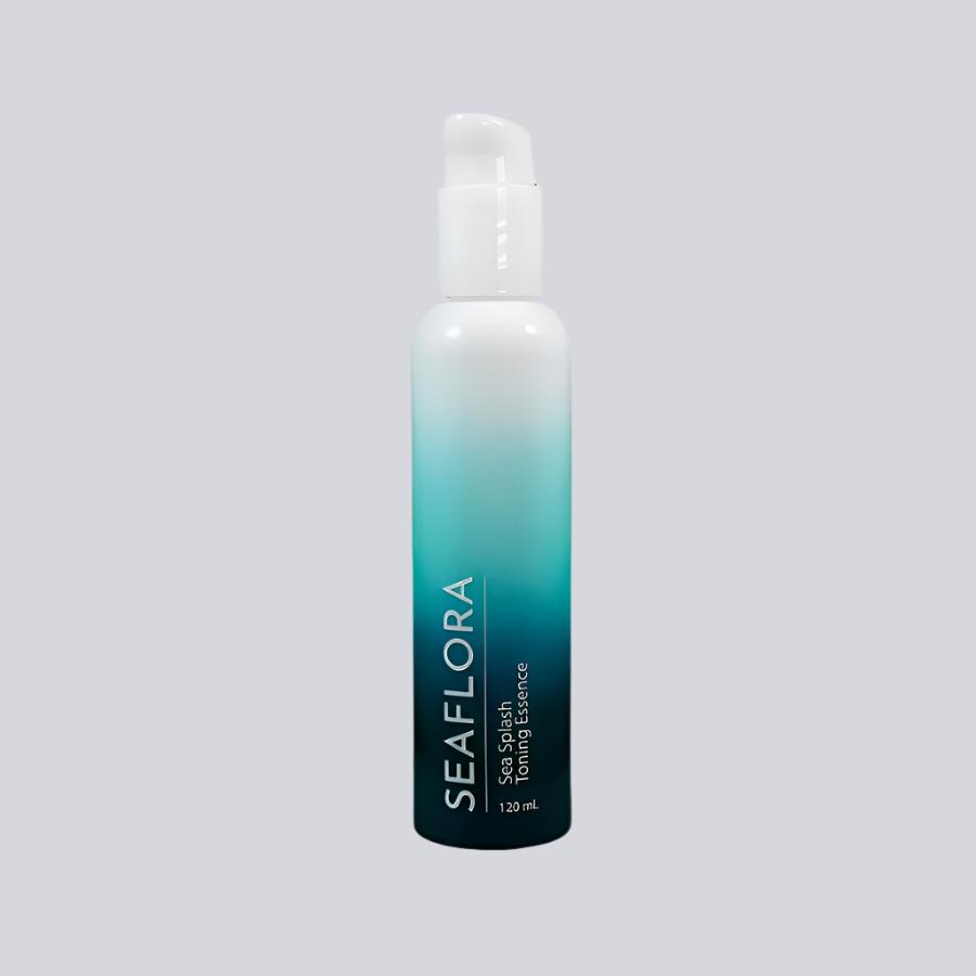 Seaflora - Sea Splash Toning Essence in white fade bottle to aqua and dark aqua - vertical white branding of Seaflora label