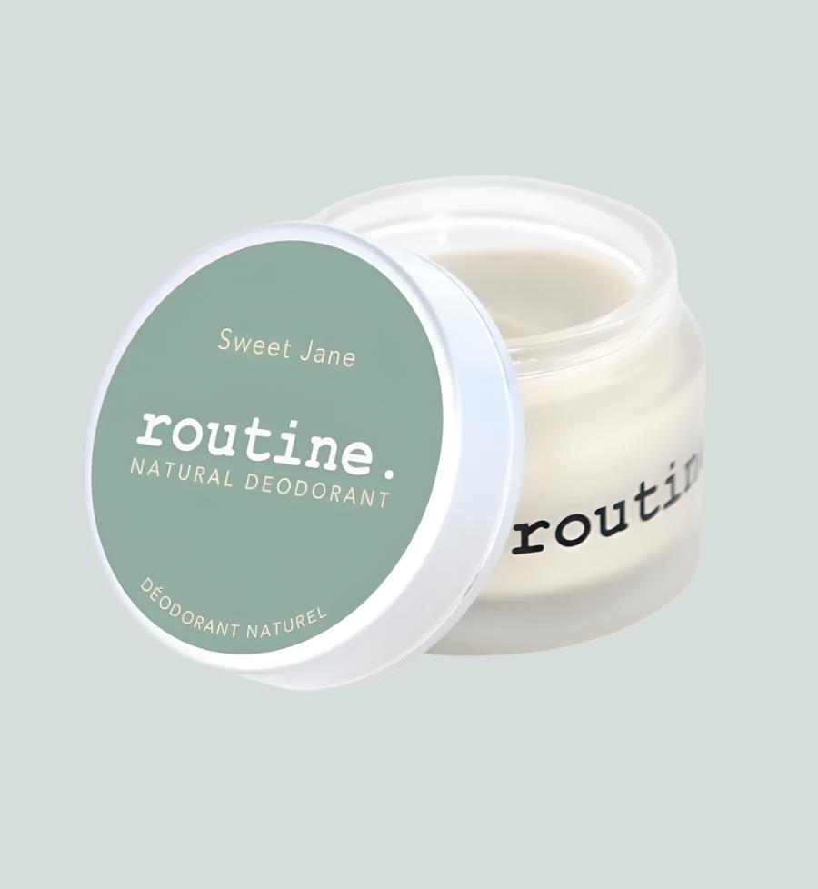 Sage green Sticker on Jar. Open lid of Routine Natural Deodorant Cream - Sweet Jane displayed on a white background.