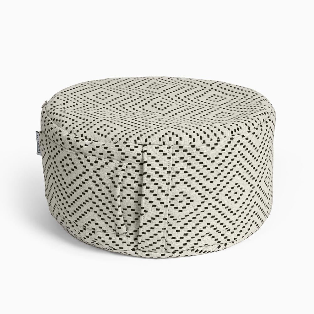 
                  
                    The Calm - Meditation Cushion in beige and black colour - Modern City Day - round modern cushion with removable washable cover photographed close up on a white background 
                  
                