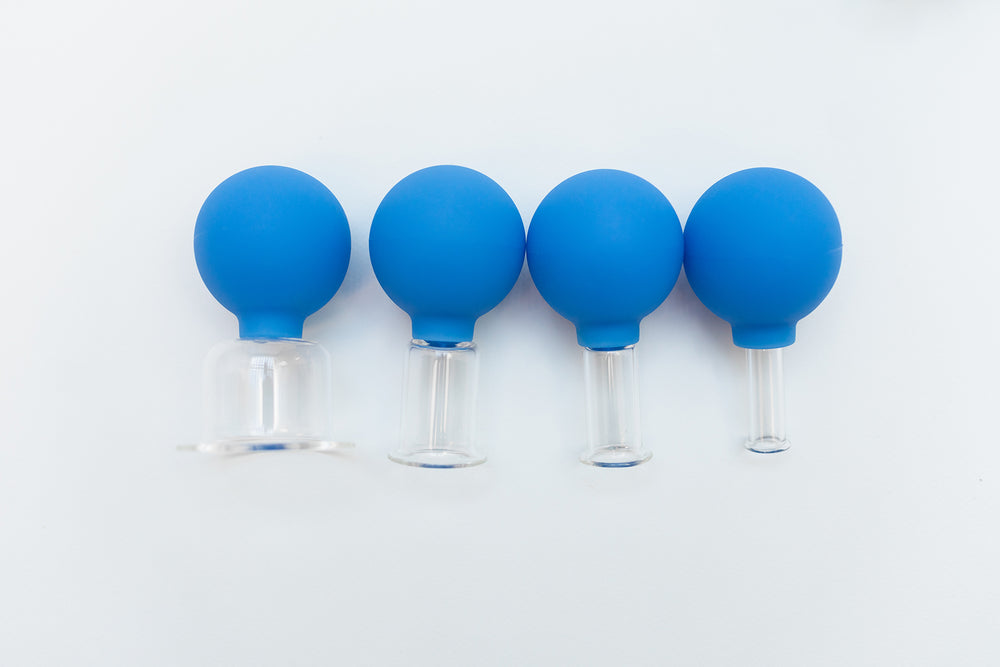 Display of all four different sizes of Blue Glass Facial Cups