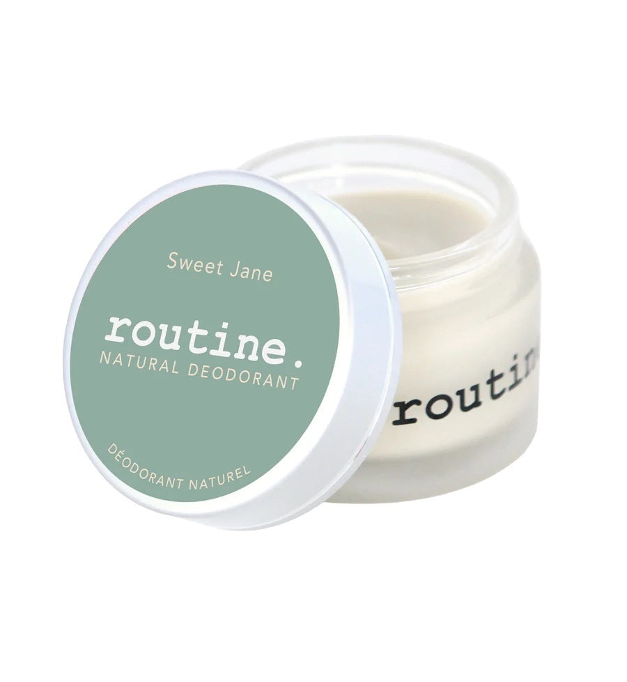Sage green Sticker on Jar. Open lid of Routine Natural Deodorant Cream - Sweet Jane displayed on a white background.