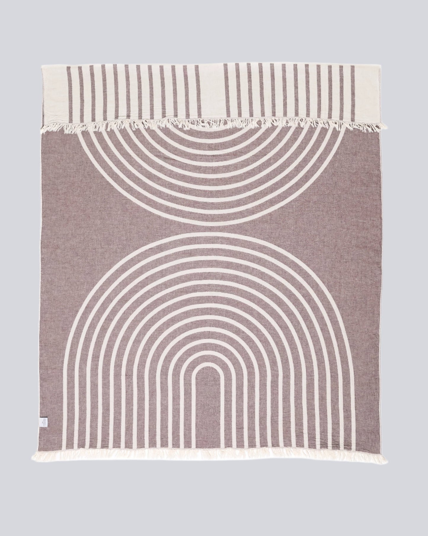 The Zen Throw by Tofino Towel Company - in wine colour, a rainbow design with white and wine colour.