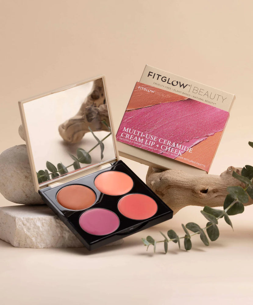 Fitglow Beauty - Lip & Cheek palette - 4 colours open and displayed with a beige background staged with wood and eucalyptus.