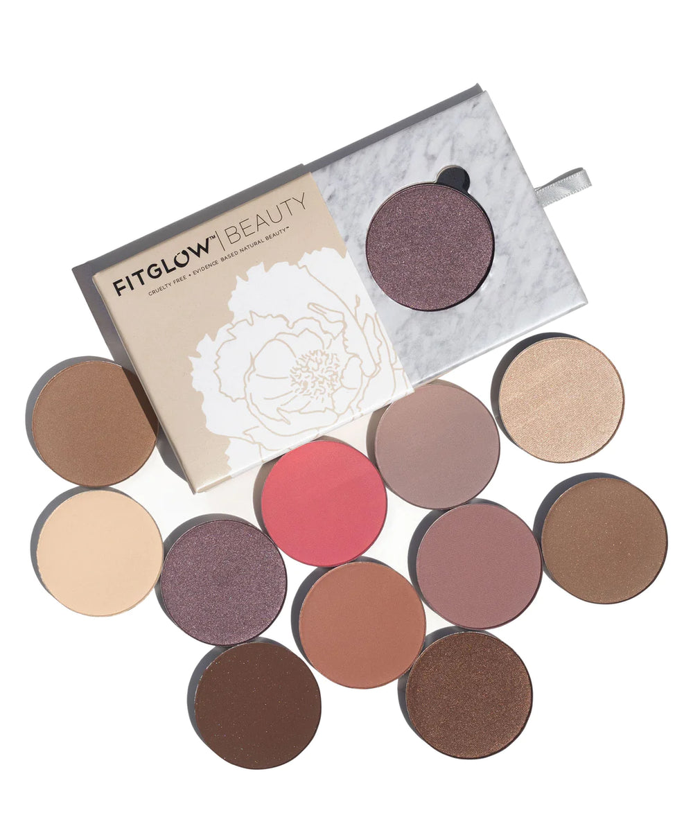FITGLOW BEAUTY - multi use pressed shadow and blush - displayed with all 12 shades of round small palettes on a white clean background.